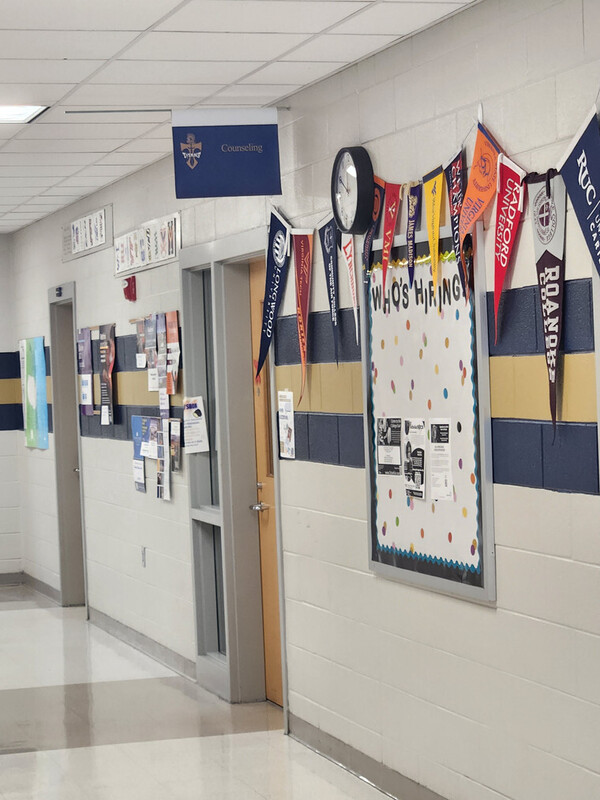 The entrance to the career counseling department at HVHS with flags of many of the potential college options. 